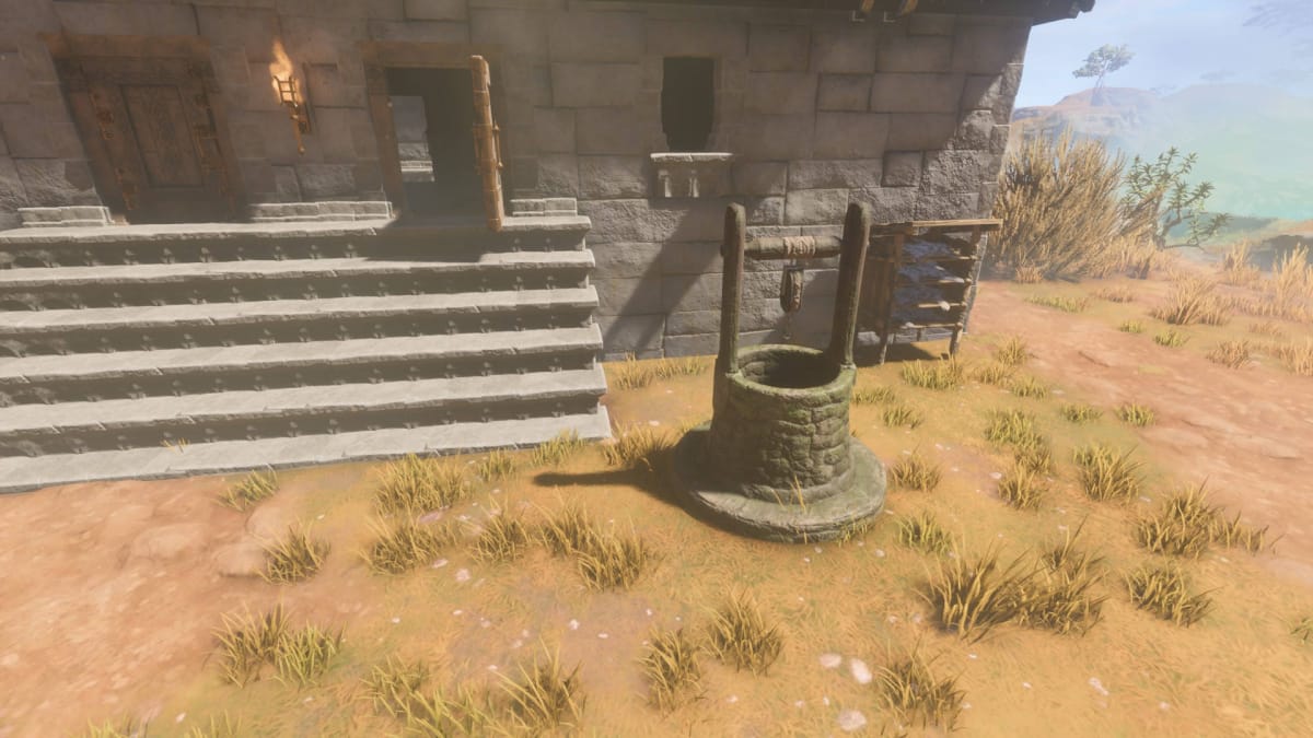 How to Get Water in Enshrouded - Cover Image Well Outside of a Stone Building in the Nomad Highlands